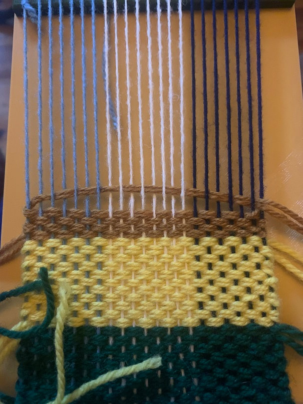 Weaving on a small hand made looms